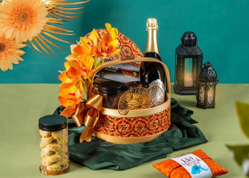 Festive hamper with sparkling drink and florals